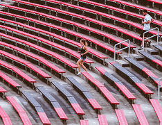 people running stadium bleachers