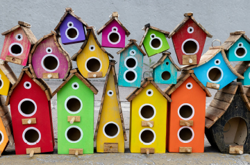 A collection of colorful bird houses