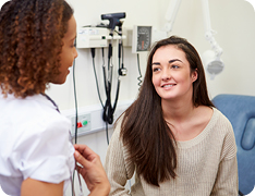 patient speaking with nurse