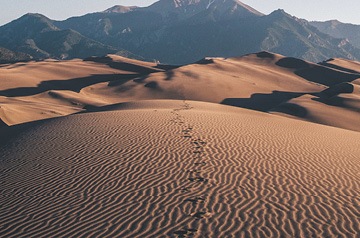 footsteps in sand dunes