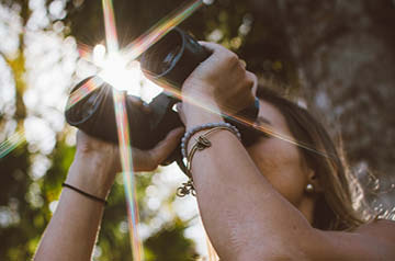 looking through binoculars