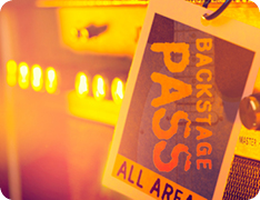 backstage pass hanging from hook