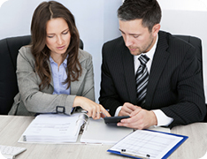 two professionals collaborating at desk
