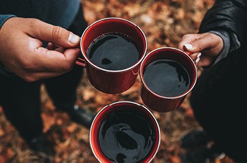 cheers with coffee mugs