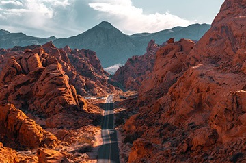 roadway through craggy desert landscape