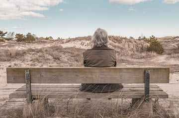 sitting on bench at beach