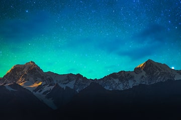 aurora borealis over mountains