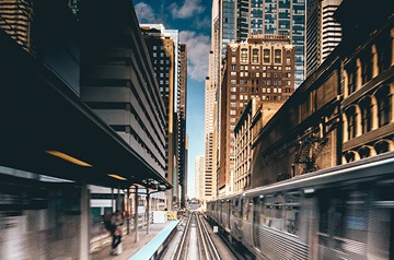 train zooming by in city station
