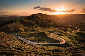 windy mountain road at sunset