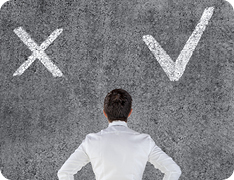 a man facing a wall with an X to the left and a checkmark to the right