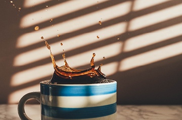 coffee splashing out of mug