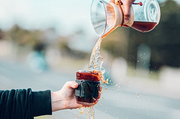 pitcher of iced tea being poured into a glass
