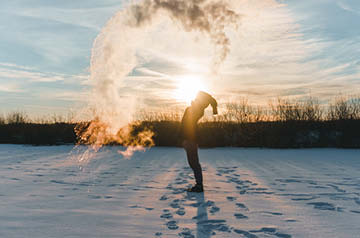 tossing snow skyward