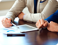 doctor reviewing documents on iPad with patient