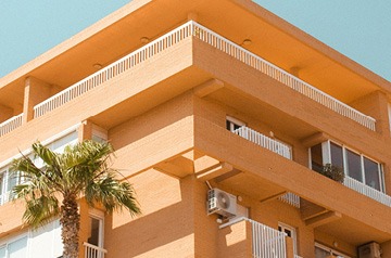 Orange building, palm tree