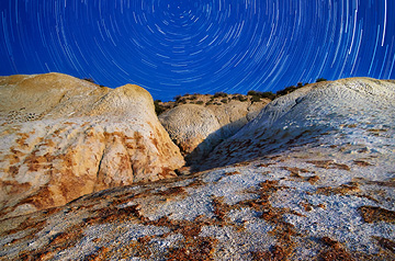 long exposure of night sky over desert