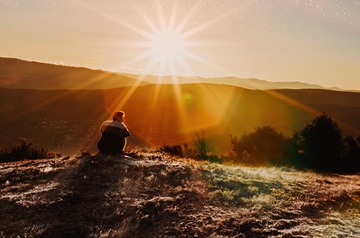 watching sunset over hills