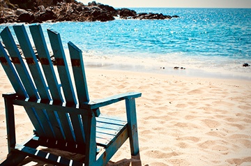 empty chair on sandy beach