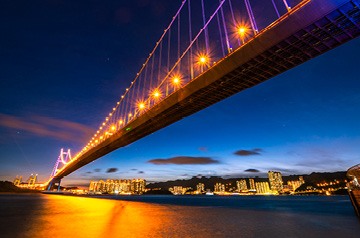 brightly lit bridge at night
