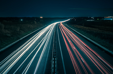 timelapse of highway at night