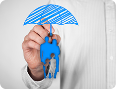 man drawing an umbrella over a depiction of a family