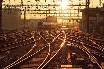 Rail lines crossing over each other in a train yard.