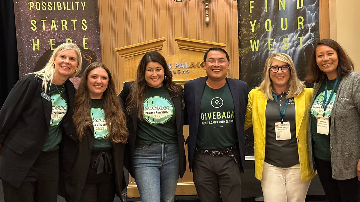 People posing for a photo at a conference
