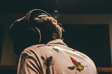 wearing headphones in music studio