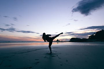 silhouette of martial arts on beach