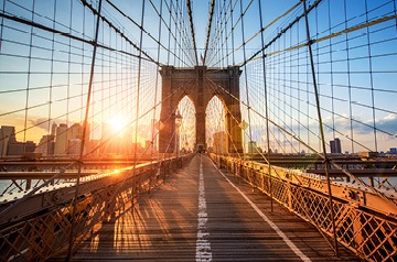 Sun shining through the Brooklyn Bridge