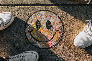 sidewalk chalk drawing of smiley face