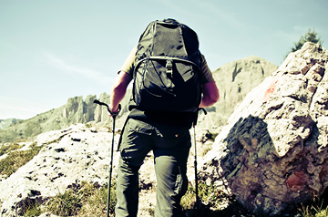 hiker climbing rocky terrain