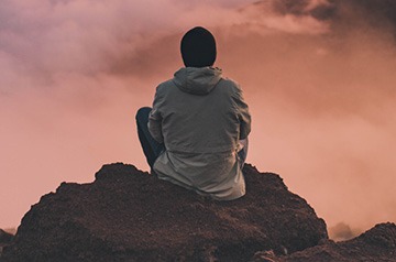 hiker viewing foggy landscape