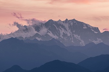 snowy mountain tops at sunset