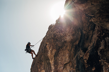 Climbing mountain setting sun