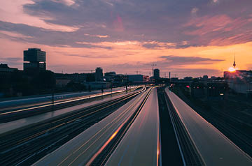 Looking down a highway at sunset