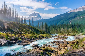 Mountain valley with stream running through it