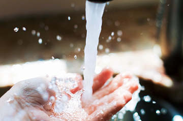 cupped hand under running water