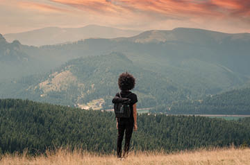 looking over valley, grassy hills behind
