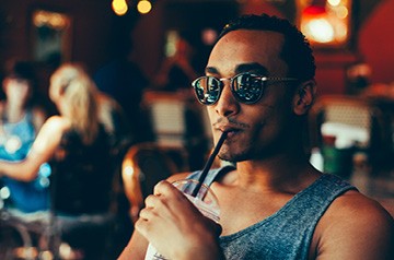 drinking cold beverage in cafe