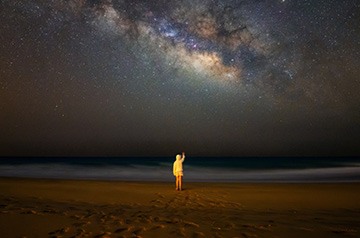 long exposure of night sky over beach