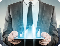 businessman holding tablet showing holographic bar graph