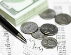 closeup of cash and coins on balance sheet