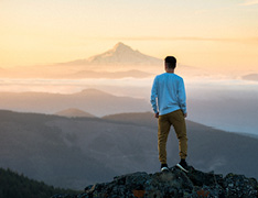 hiker overlooking mountain range
