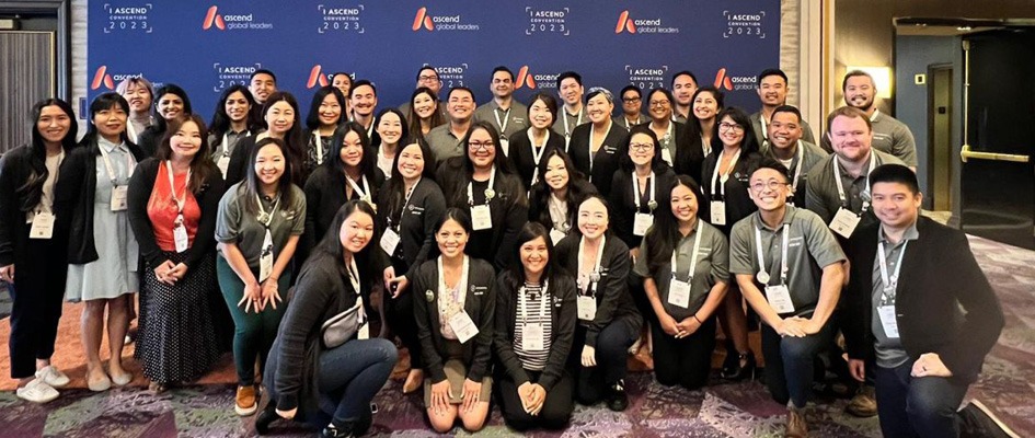 People posing for a photo at a conference