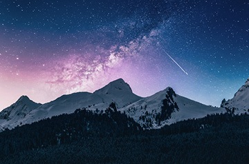 shooting star over mountains