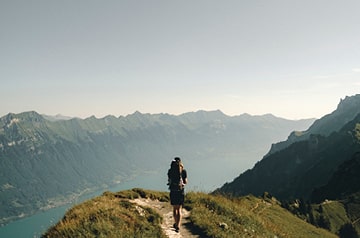 hiker overlooking river valley