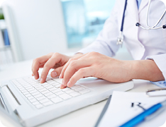 doctor's hands on keyboard